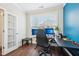 Functional home office space with a large window, a modern desk, and natural light at 3929 Glenlake Garden Dr, Raleigh, NC 27612