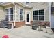 Cozy patio area with outdoor furniture, perfect for relaxing or entertaining guests in the backyard at 3929 Glenlake Garden Dr, Raleigh, NC 27612