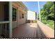 A small deck off the back of the house featuring a wooden railing and direct yard access at 400 Leacroft Way, Morrisville, NC 27560