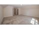 Spacious bedroom featuring neutral carpet, recessed lighting, and a walk-in closet at 400 Leacroft Way, Morrisville, NC 27560