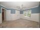 Blue bedroom with tan carpet, white wainscotting, and closet at 400 Leacroft Way, Morrisville, NC 27560