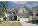 Charming two-story home featuring a two-car garage and well-maintained landscaping at 400 Leacroft Way, Morrisville, NC 27560