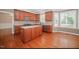 Well-equipped kitchen with wooden cabinetry, stainless appliances, and a center island at 400 Leacroft Way, Morrisville, NC 27560