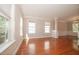 Bright living room with hardwood floors, large windows, and detailed trim at 400 Leacroft Way, Morrisville, NC 27560