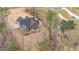 Beautiful aerial view of a well-maintained two-story home surrounded by lush trees at 442 Hunters Pointe Rd, Nashville, NC 27856