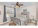 Cozy bedroom featuring a decorative iron bed frame, a ceiling fan, and natural light from the window at 442 Hunters Pointe Rd, Nashville, NC 27856