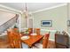 Cozy dining room featuring hardwood floors and a contemporary chandelier at 442 Hunters Pointe Rd, Nashville, NC 27856