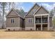 Backyard exterior with a porch area, showcasing a well-maintained lawn and outdoor space at 442 Hunters Pointe Rd, Nashville, NC 27856