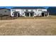 View of backyard featuring screened patios, level grass, and privacy fence at 5014 Kota St, Raleigh, NC 27610