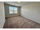 Bedroom with carpeted floors, neutral paint, and a window at 5014 Kota St, Raleigh, NC 27610