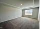 Bright, spacious bedroom with neutral carpet, ample natural light, and a serene atmosphere at 5014 Kota St, Raleigh, NC 27610