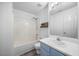 Bright bathroom featuring a shower-tub combo and vanity sink at 513 Jaffiley Ct, Wake Forest, NC 27587
