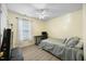 Cozy bedroom with neutral walls, ceiling fan, and ample natural light at 513 Jaffiley Ct, Wake Forest, NC 27587
