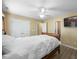 Bright bedroom with neutral walls, ceiling fan, and ample closet space at 513 Jaffiley Ct, Wake Forest, NC 27587