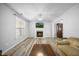 Cozy living room with a fireplace, neutral paint, and modern flooring at 513 Jaffiley Ct, Wake Forest, NC 27587