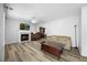 Cozy living room with a fireplace, neutral paint, and modern flooring at 513 Jaffiley Ct, Wake Forest, NC 27587