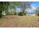 Expansive backyard featuring mature trees, with plenty of room for recreation and relaxation at 513 Kenway St, Garner, NC 27529