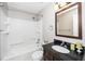 Bathroom featuring a tub shower and dark vanity at 513 Kenway St, Garner, NC 27529