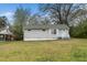 Cozy single-story home featuring light gray siding, a green lawn, and an inviting front entrance with great natural light at 513 Kenway St, Garner, NC 27529