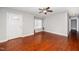 Cozy living room featuring hardwood floors, bright windows, and a welcoming white front door for a comfortable living space at 513 Kenway St, Garner, NC 27529