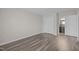 Spacious bedroom with wood-look flooring, a closet, and ensuite bathroom access at 60 Justin Ct, Durham, NC 27705