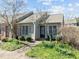 Attractive home with a well-maintained lawn and colorful flowers enhancing the curb appeal at 60 Justin Ct, Durham, NC 27705