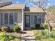 Inviting home exterior featuring a cozy entrance and blossoming flowers in the garden at 60 Justin Ct, Durham, NC 27705
