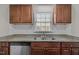 Updated kitchen with granite countertops and stainless steel dishwasher at 60 Justin Ct, Durham, NC 27705