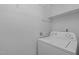 Close up of a white washing machine in a well lit laundry room at 60 Justin Ct, Durham, NC 27705