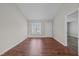 Open living room with hardwood floors and natural light at 60 Justin Ct, Durham, NC 27705