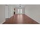 Bright living room featuring hardwood floors, ceiling fan, and door to a patio at 60 Justin Ct, Durham, NC 27705