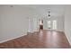 Bright living room featuring hardwood floors, ceiling fan, and door to a patio at 60 Justin Ct, Durham, NC 27705