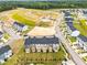 An aerial view highlighting new construction homes, community layout, and landscaping, ideal for prospective buyers at 605 Silverado Sunset Loop, Wendell, NC 27591