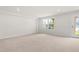 Unfinished basement with a window and an access door to the yard at 605 Silverado Sunset Loop, Wendell, NC 27591