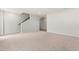 Unfinished basement with stairs and a white door at 605 Silverado Sunset Loop, Wendell, NC 27591