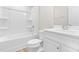 Bright white bathroom with a shower-tub combo and modern vanity at 605 Silverado Sunset Loop, Wendell, NC 27591