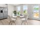 Dining area with seating for four featuring access to a deck at 605 Silverado Sunset Loop, Wendell, NC 27591