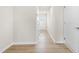 Hallway with entry door, access to various living spaces and luxury vinyl plank flooring at 605 Silverado Sunset Loop, Wendell, NC 27591