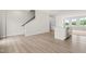 Bright living space featuring stairs to the second level and access to the kitchen at 605 Silverado Sunset Loop, Wendell, NC 27591