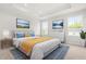 Cozy main bedroom featuring a tray ceiling, a king bed, and lots of natural light at 605 Silverado Sunset Loop, Wendell, NC 27591