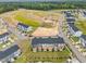 New community construction with townhomes, green spaces, and newly paved roads at 607 Silverado Sunset Loop, Wendell, NC 27591