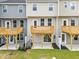 Townhome backyard with patio and deck, offering outdoor living space at 607 Silverado Sunset Loop, Wendell, NC 27591