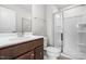 Bathroom with a glass-enclosed shower, stylish vanity, and modern fixtures at 607 Silverado Sunset Loop, Wendell, NC 27591