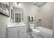 Neutral toned bathroom featuring a vanity and tiled bathtub with shower at 607 Silverado Sunset Loop, Wendell, NC 27591