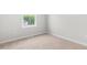 This bedroom offers neutral carpeting and a window for natural light at 607 Silverado Sunset Loop, Wendell, NC 27591