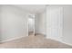 Carpeted bedroom with multiple doors leading to other parts of the house at 607 Silverado Sunset Loop, Wendell, NC 27591