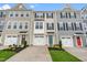 View of a row of modern townhomes with attached garages at 607 Silverado Sunset Loop, Wendell, NC 27591