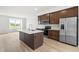 Spacious kitchen with stainless appliances, island and modern design at 607 Silverado Sunset Loop, Wendell, NC 27591