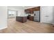 Well-lit kitchen features stainless steel appliances and a center kitchen island at 607 Silverado Sunset Loop, Wendell, NC 27591