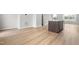 Open-concept kitchen view showcases modern flooring and a functional kitchen island at 607 Silverado Sunset Loop, Wendell, NC 27591